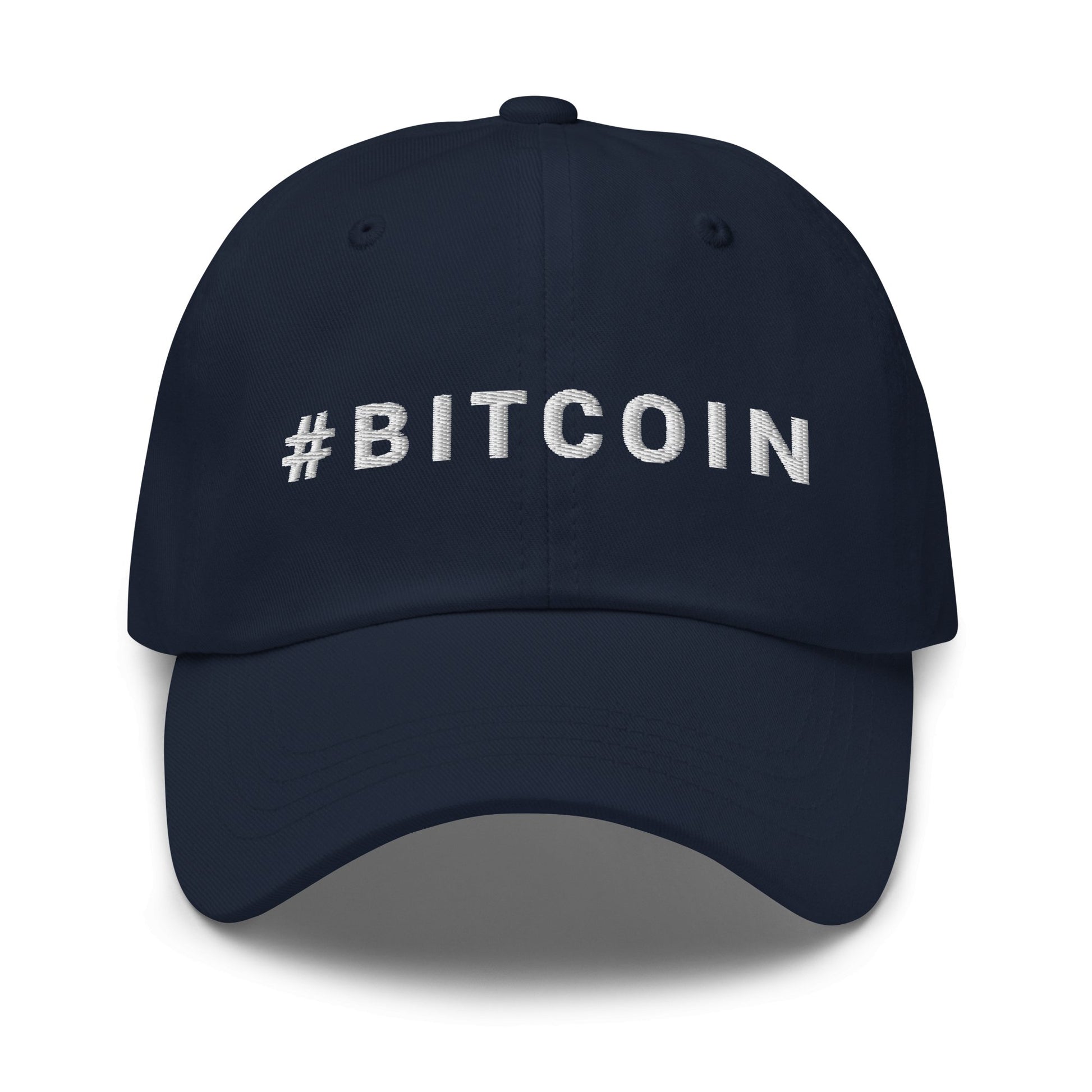 Introducing the Hashtag Hat: a sleek black baseball cap with "#BITCOIN" elegantly embroidered in striking white capital letters across the front. Ideal for crypto enthusiasts roaming vibrant cities such as Sydney and Melbourne, this cap boasts a curved brim and detailed stitching on each panel and the brim.