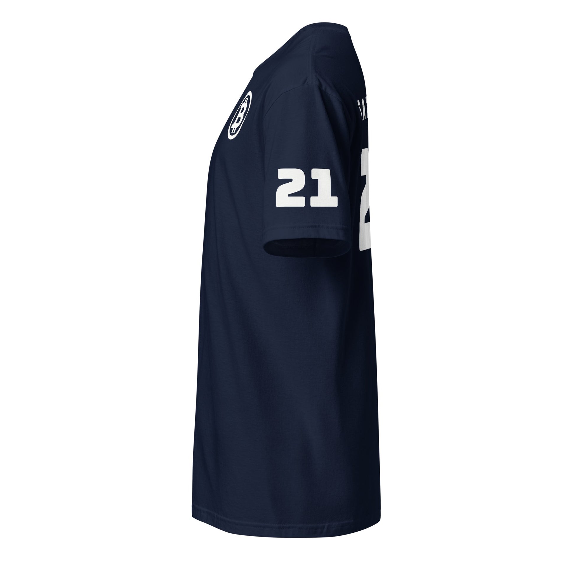 The Satoshi 21 T-Shirt is depicted from the right side in navy blue, displaying the number "21" in white on the sleeve and side. It features a round neck with short sleeves, and there is text or a logo partially visible at the top of the back, likely reflecting Sydney's vibrant style.