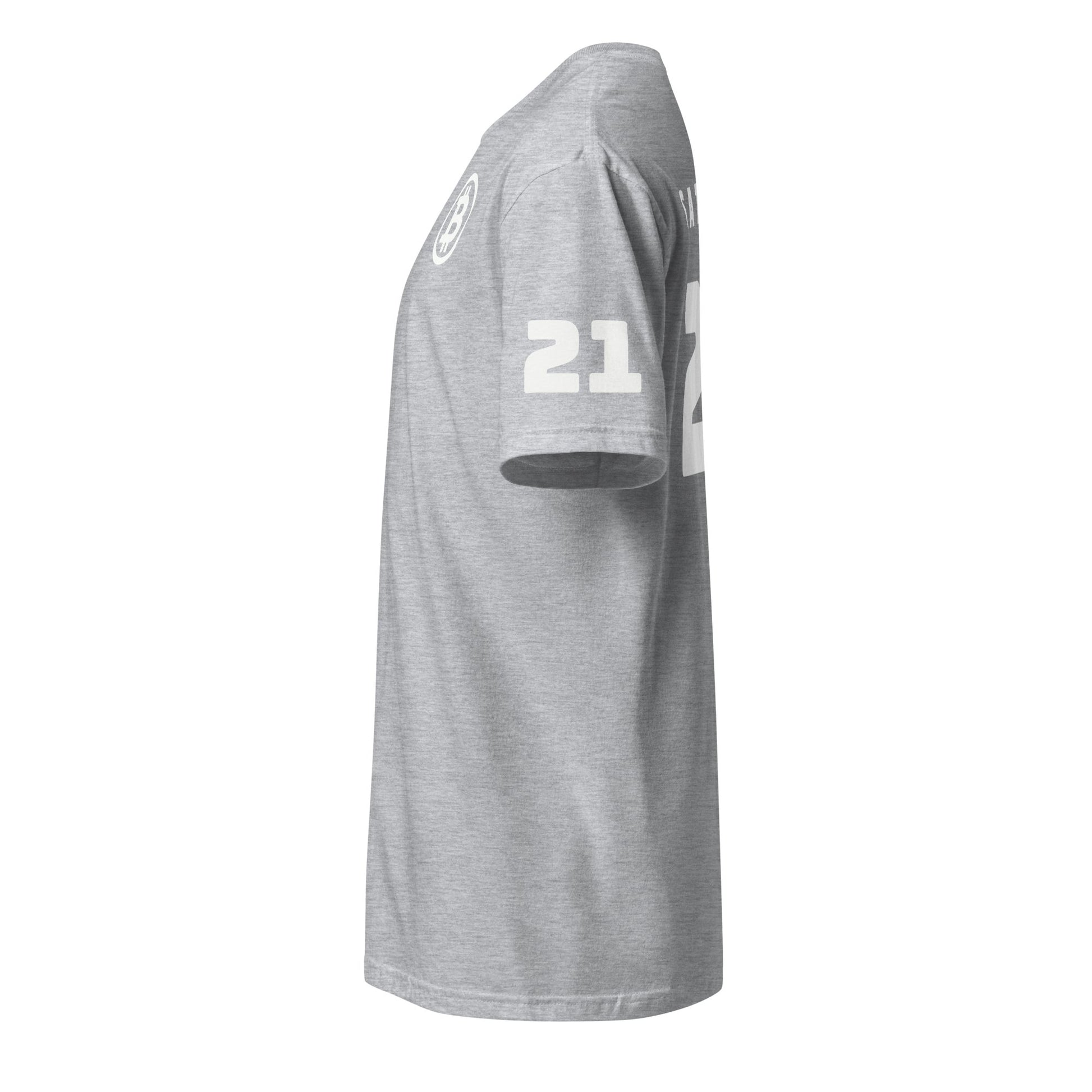 Side perspective of a gray Satoshi 21 T-Shirt showcasing the number "21" in white on one sleeve. The fabric offers a casual fit and features a round neckline. Falling below the waist, it displays no visible logos on this side, evoking the laid-back style commonly seen in Sydney or Melbourne's street fashion.