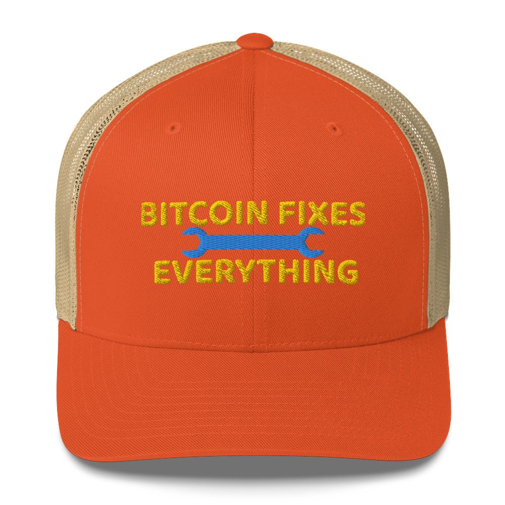 Orange and tan UTXO Dreams trucker hat with the slogan "Bitcoin Fixes Everything" embroidered in front.